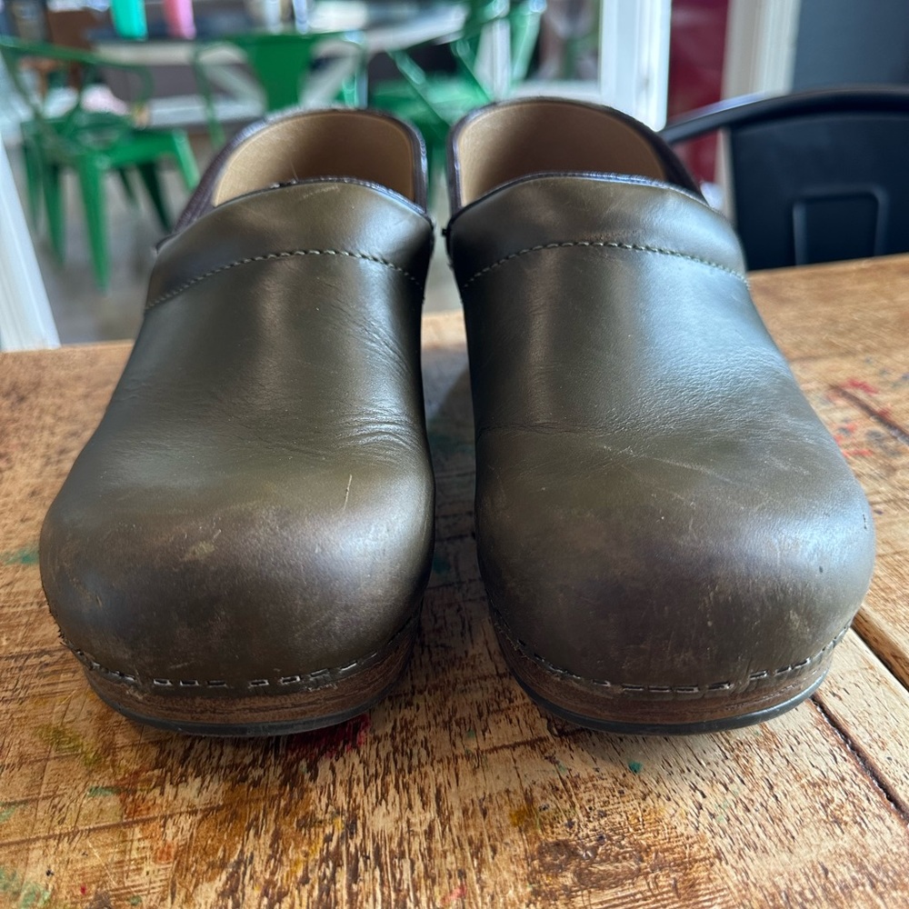 Olive green Dansko clogs. Used but sole and and bottom in excellent condition